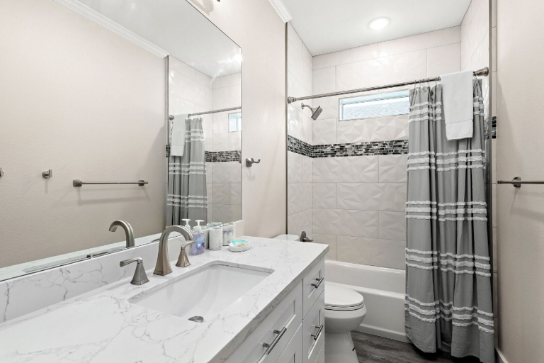 Second bathroom off hallway with tub/shower combo