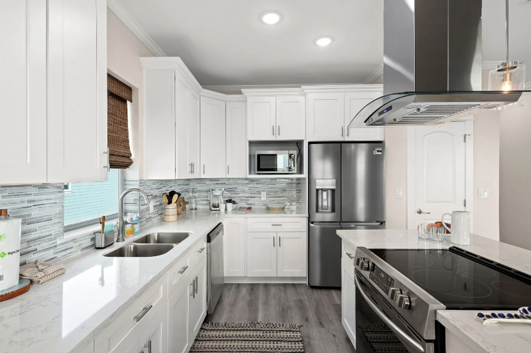 Modern kitchen, fully stocked with pots, pans, dishes, and more.  A coffee station will be provided