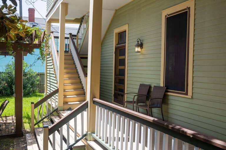 Exterior stairs and access to backyard