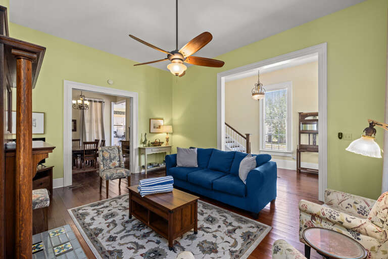 Living Room Adjacent to Dining Room, Entryway, Stairs, and Hallway.