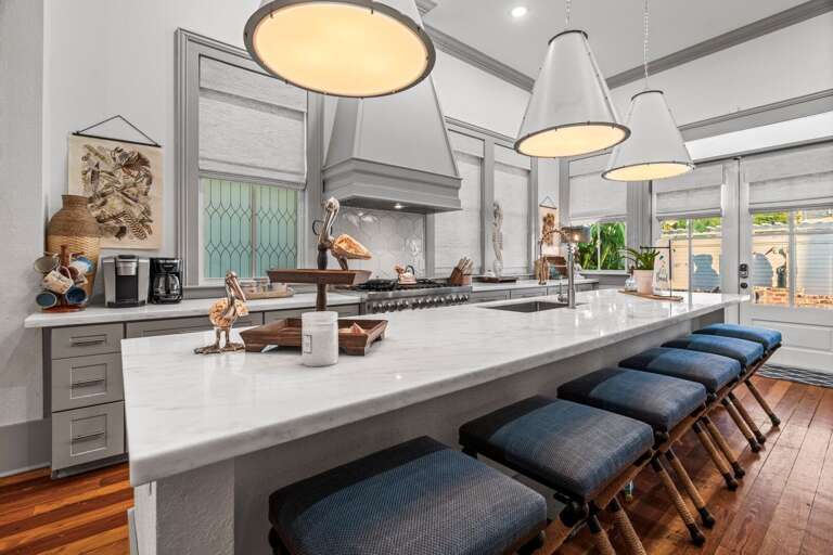 In addition to a large dining table, there is bar seating, as well. In addition to a large dining table, there is bar seating, as well.