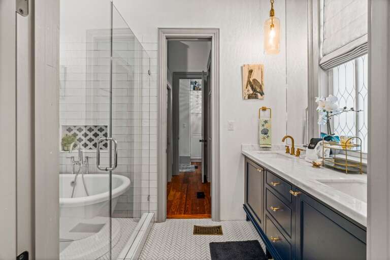 Bathroom one with double vanity sinks and a shower/tub combination for your relaxation.