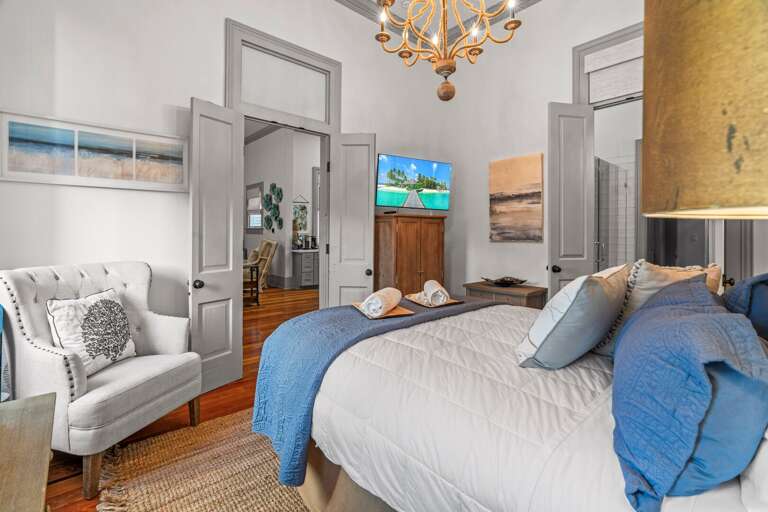 Downstairs Master bedroom w/ King size bed and TV Downstairs Master bedroom w/ King size bed and TV