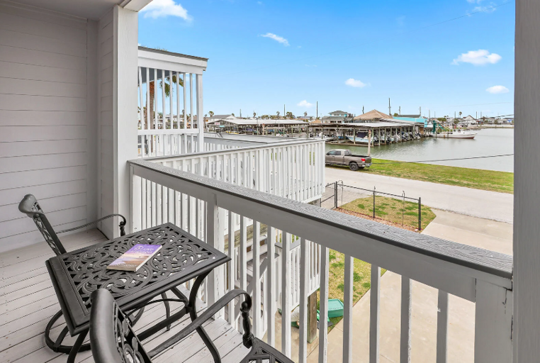 Two bedrooms with private balonies and a water view