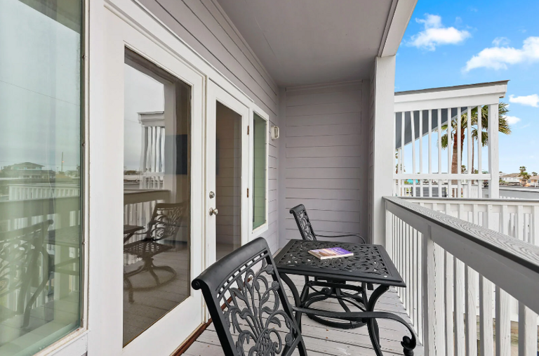 Two bedrooms with private balonies and a water view