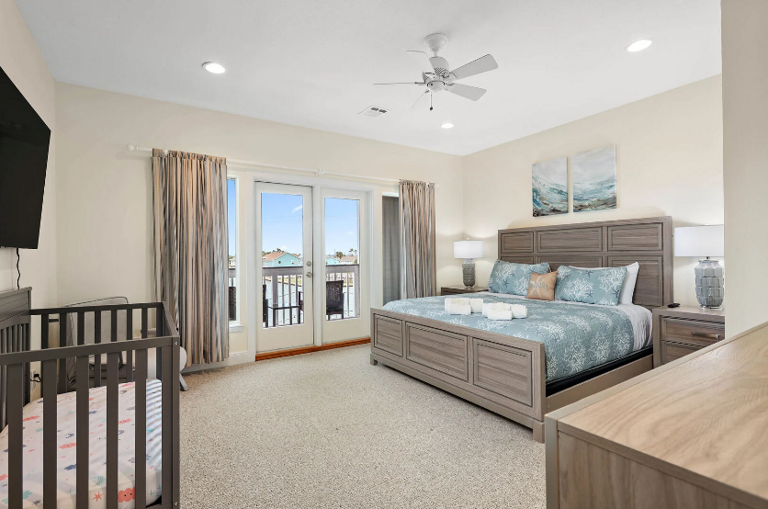 Private balcony with a water view, streaming TV and a crib.