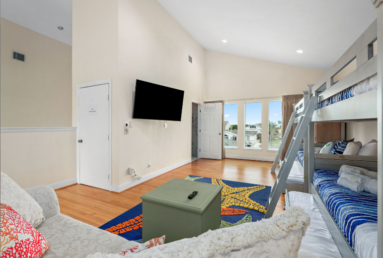 Two twin over twin beds, with  with trundles, sleeping 6.  This is part of the seconfd living area upstairs.