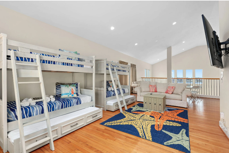 Two twin over twin beds, with  with trundles, sleeping 6.  This is part of the seconfd living area upstairs.