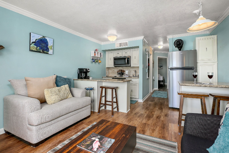 Bar seating and a fully equipped kitchen Bar seating and a fully equipped kitchen