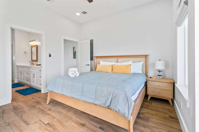 Primary bedroom features TV and en-suite bathroom