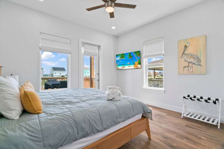 Primary bedroom with King size bed and patio access