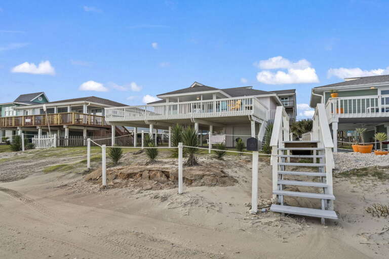 Steps from the sand, this beachfront retreat is all about wide-open views and coastal living.