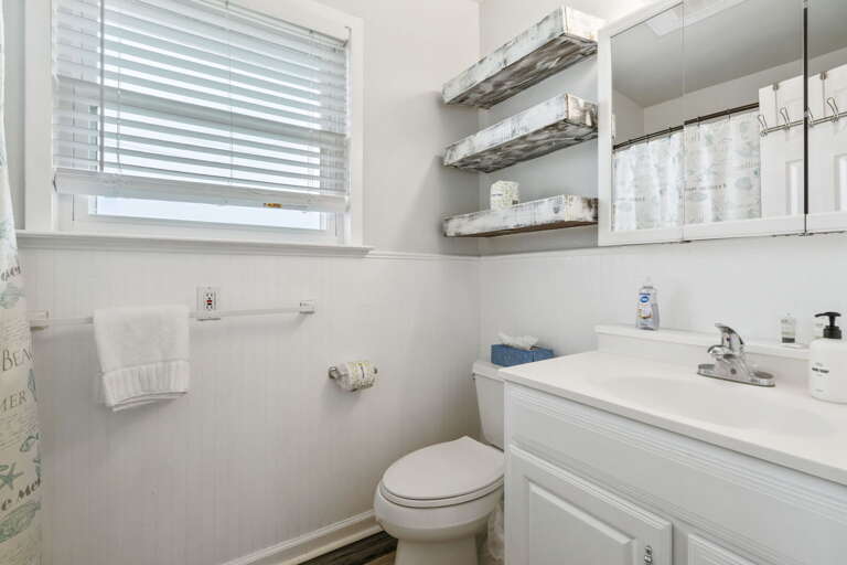Comfortable full bathroom with shower, fresh towels, and space for all your essentials.
