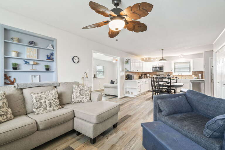 Relax in the comfortable living room that opens to the kitchen and dining area—ideal for gathering after a day of exploring.