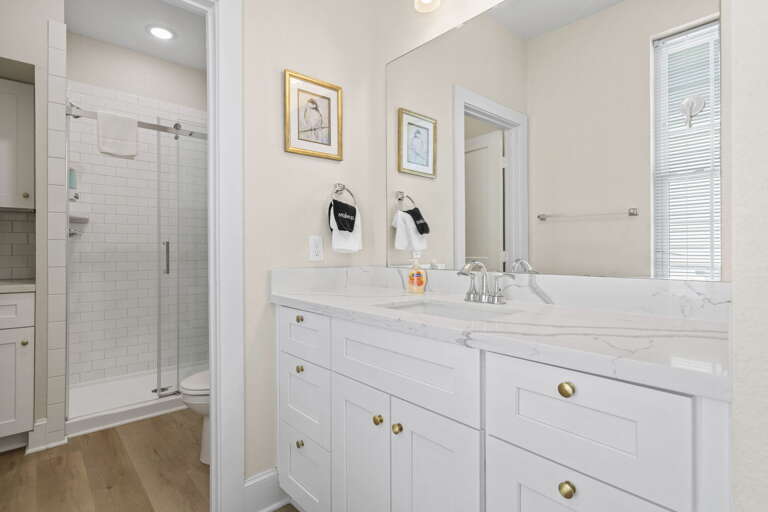 Modern bathroom with a spacious vanity and walk-in shower for a refreshing start to your day