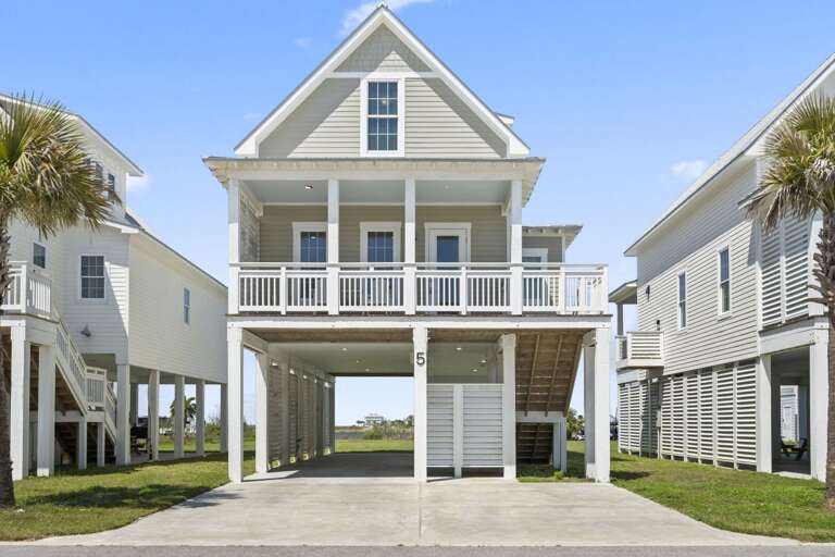 Charming coastal home with elevated design and covered parking, just steps from the beach.