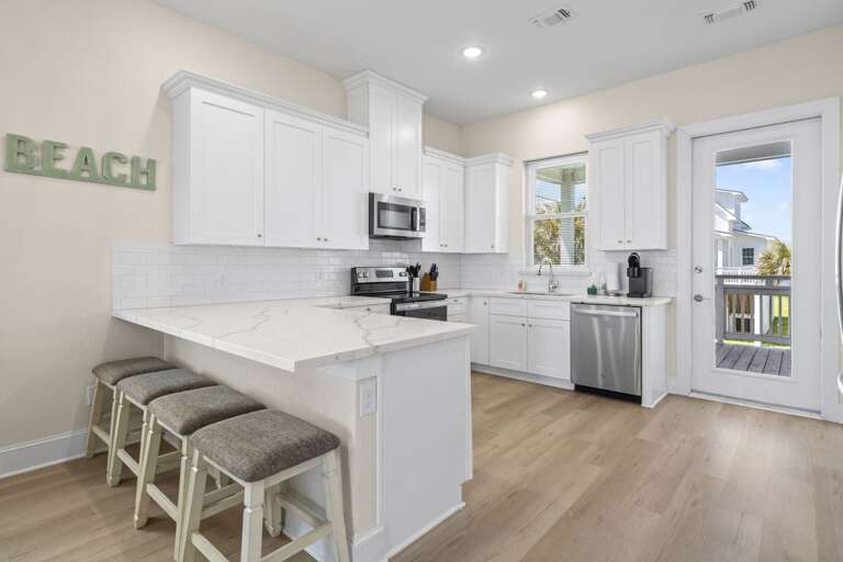 Bright, clean kitchen with everything you need to cook and unwind.