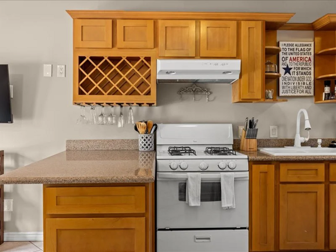 Everything you need for easy meals at home, with a gas range, generous counter space, and a convenient breakfast bar.