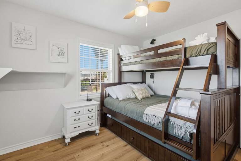 The bunk room offers plenty of sleeping space, making it a great setup for families and groups.