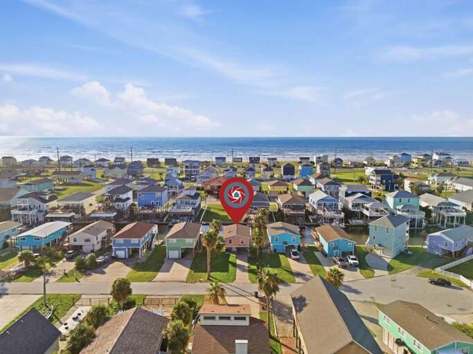 From the canal to the Gulf, this aerial view shows just how perfectly positioned Garnele's Retreat is for a Galveston getaway.