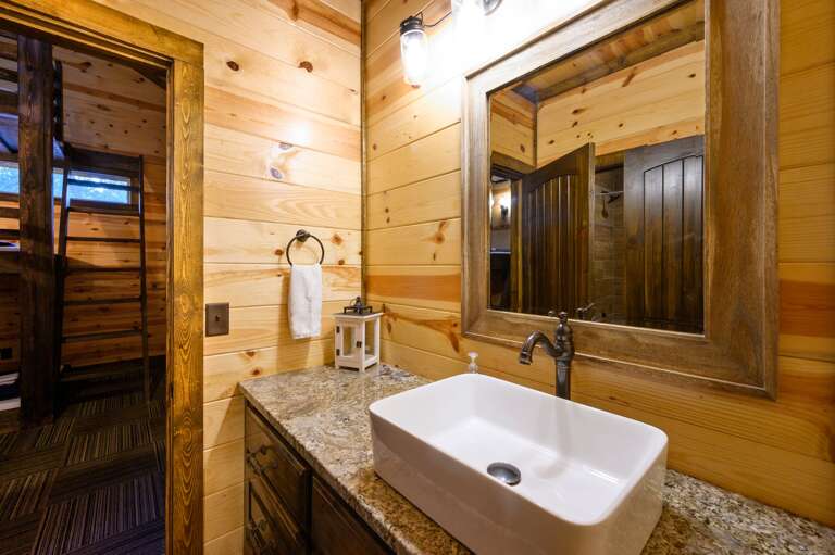 Upstairs full bathroom adjoined by both bunk and back upper bedrooms.