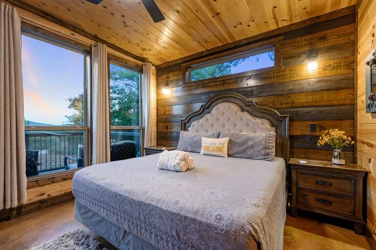 Downstairs front bedroom with king bed, desk, TV and mountain views.