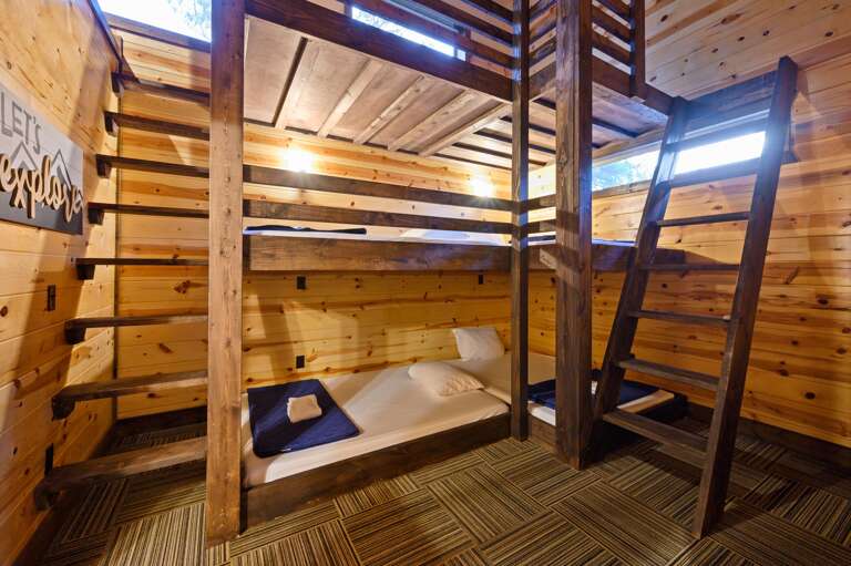 Upstairs bunk bedroom, triple bunks and loft with TV.