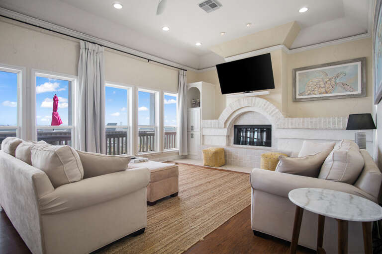 Cozy living room with large smart tv and Sonos sound system.