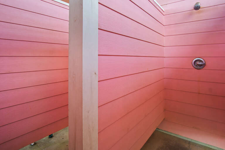 Outdoor shower with cold and hot water  lets you clean up from the beach.