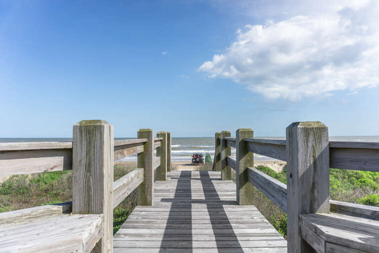 Community dune bridge deck connected to the property to get to the beach.