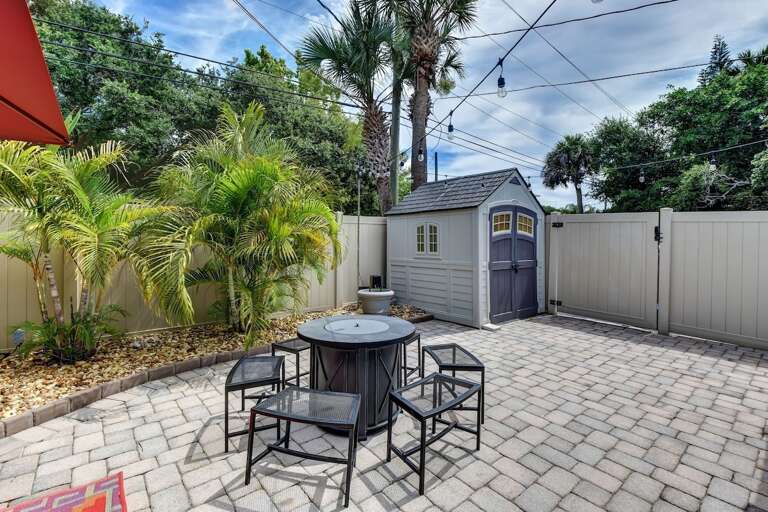 Private Fenced String-Lit Yard with Fire Pit