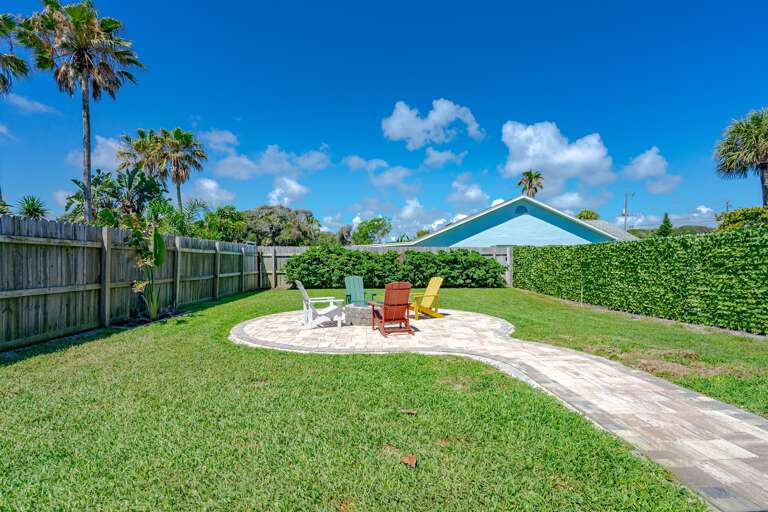 Fenced Backyard w/ Adirondack Chairs