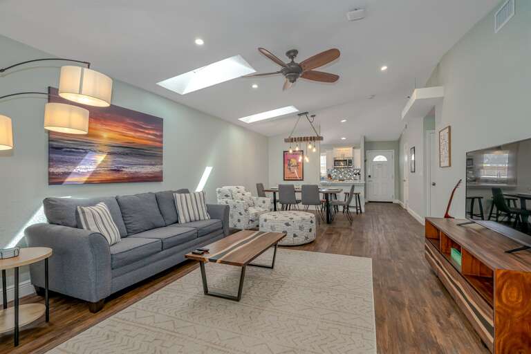 Endless Summer Living Room w/ 55" HD Smart TV and Dining Table