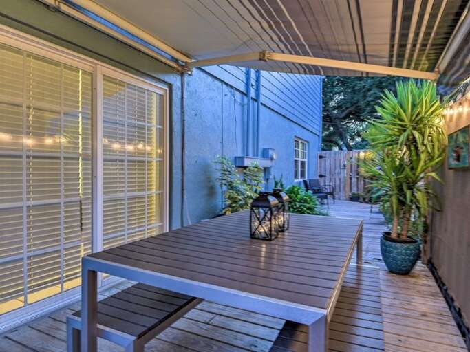 Fenced Side Yard with Awning and Dining Table