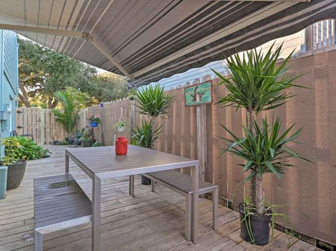 Fenced Side Yard with Awning and Dining Table