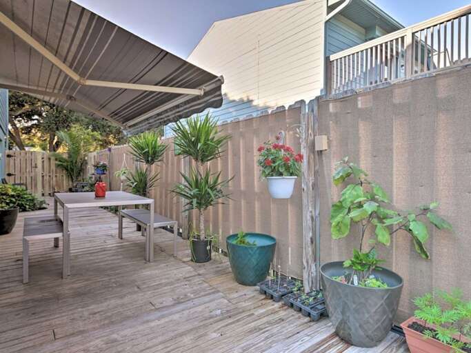 Fenced Side Yard with Awning and Dining Table
