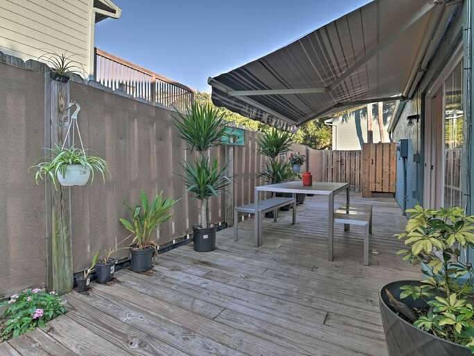 Fenced Side Yard with Awning and Dining Table