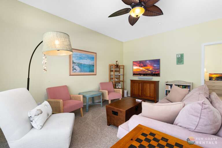 Spacious living room with ample seating and Smart TV