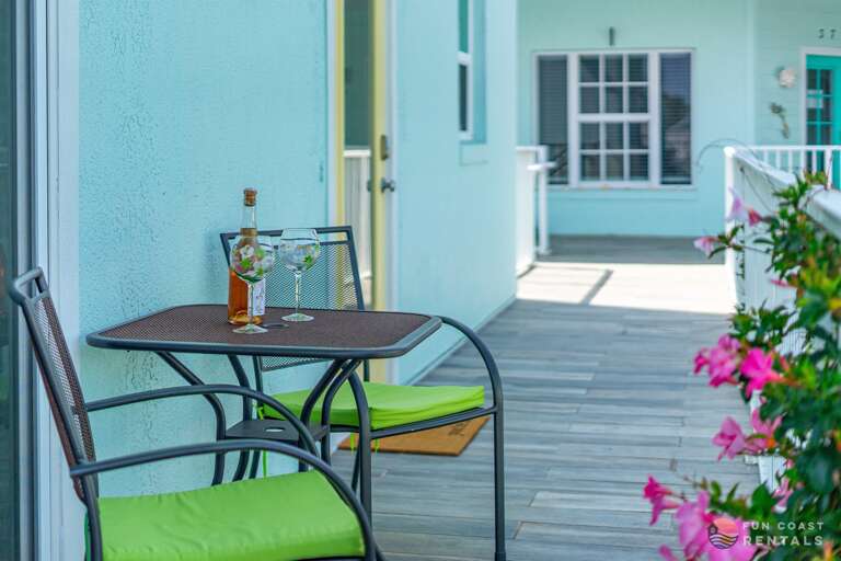 Quaint balcony overlooking community courtyard with shops and restaurants!