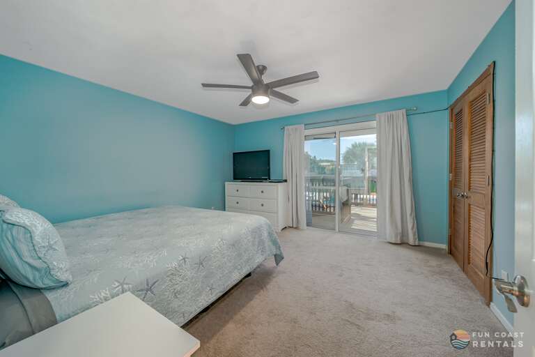 King Master Bedroom with TV and Sun Deck Access
