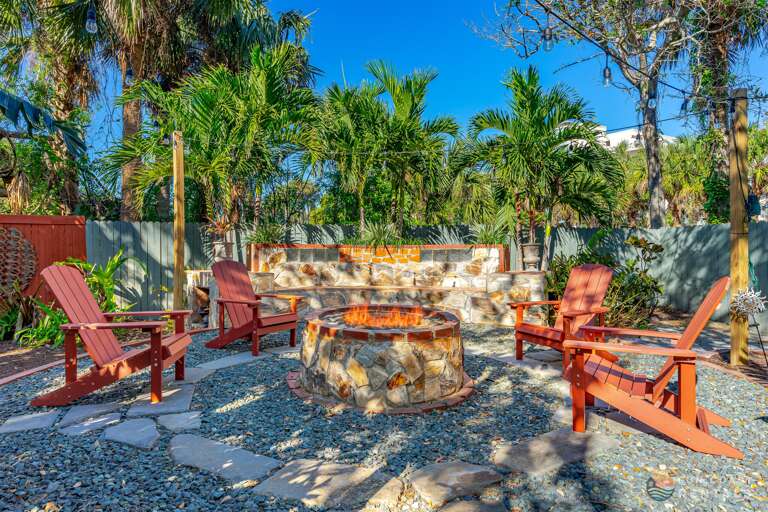 Fully fenced private string lit zen Backyard with wood fire pit!