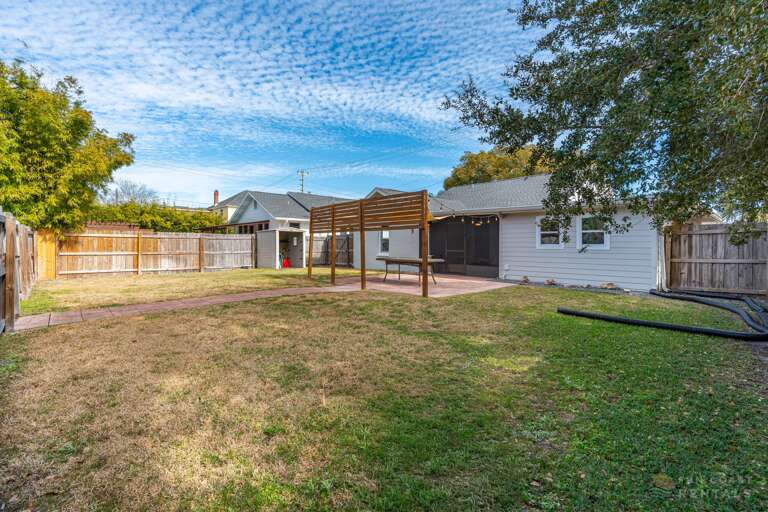 Fully Fenced Backyard with string lights