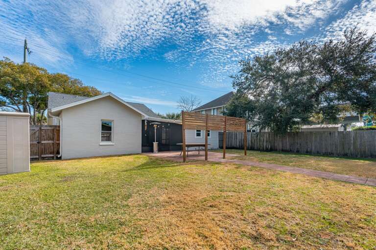 Fully Fenced Backyard with string lights
