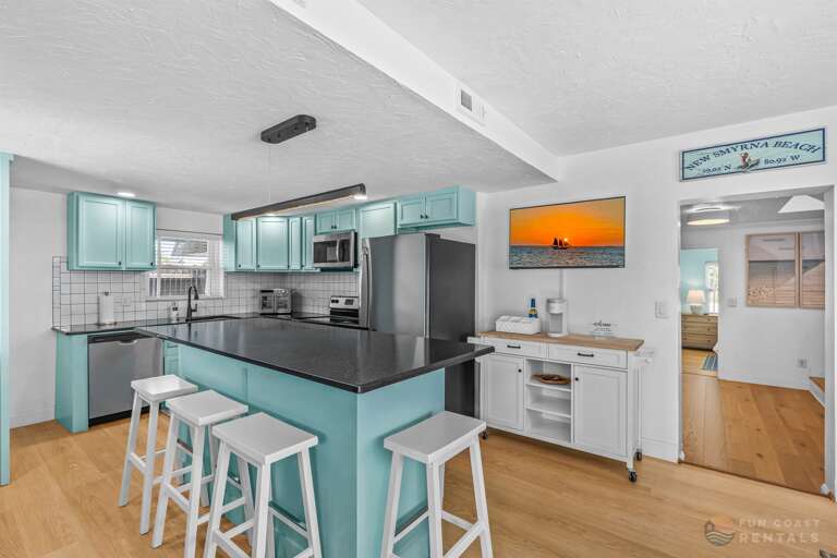 Fully equipped stainless steel Kitchen with coffee bar and island!