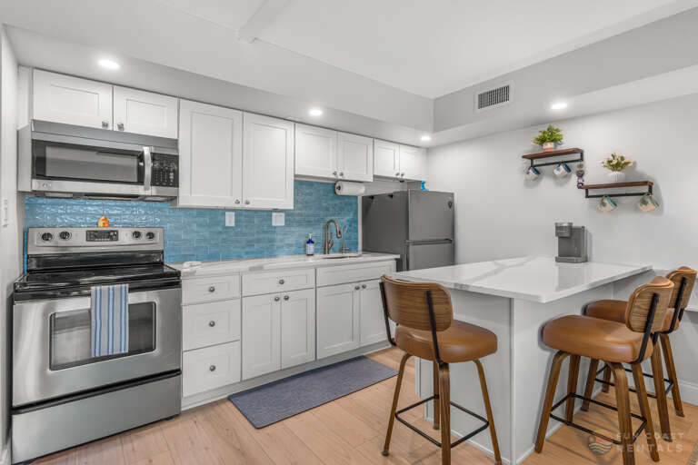 Updated Stainless Steel Kitchen with Bar Seating