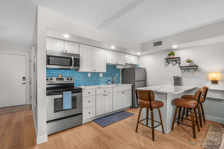 Updated Stainless Steel Kitchen with Bar Seating