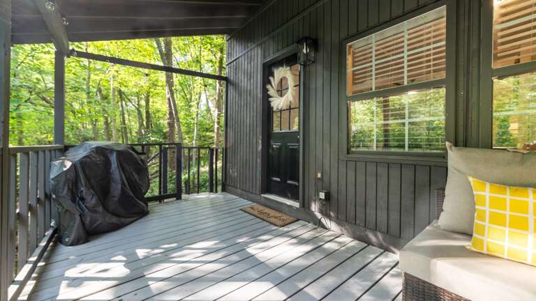 Back deck w/ propane grill and entertaining space