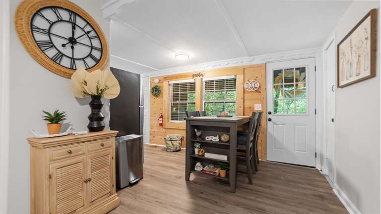 Dining area w/ 4 chairs and views of the babbling creek
