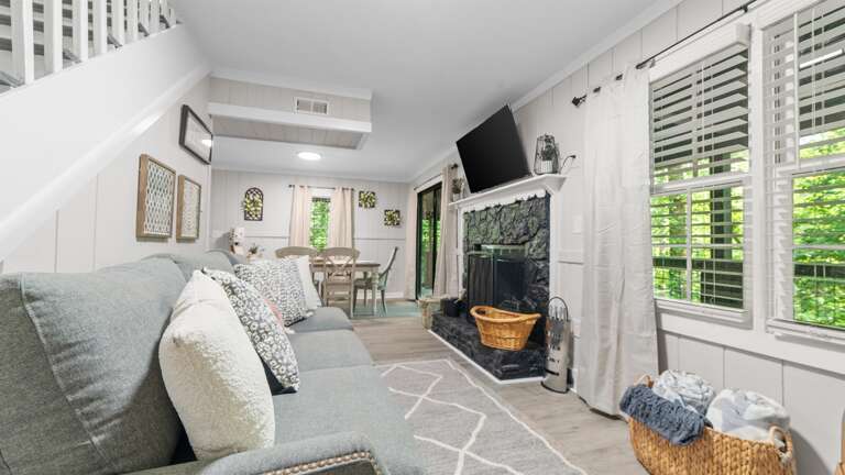 Living room w/ access to the back deck