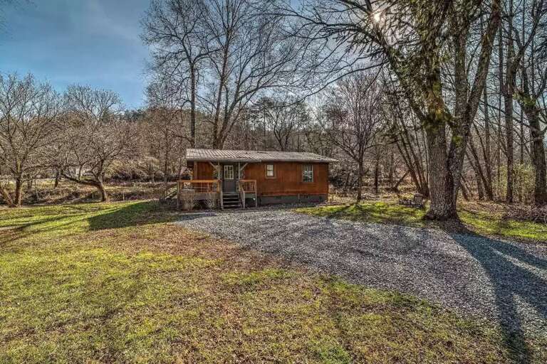 Front of house with gravel-paved parking